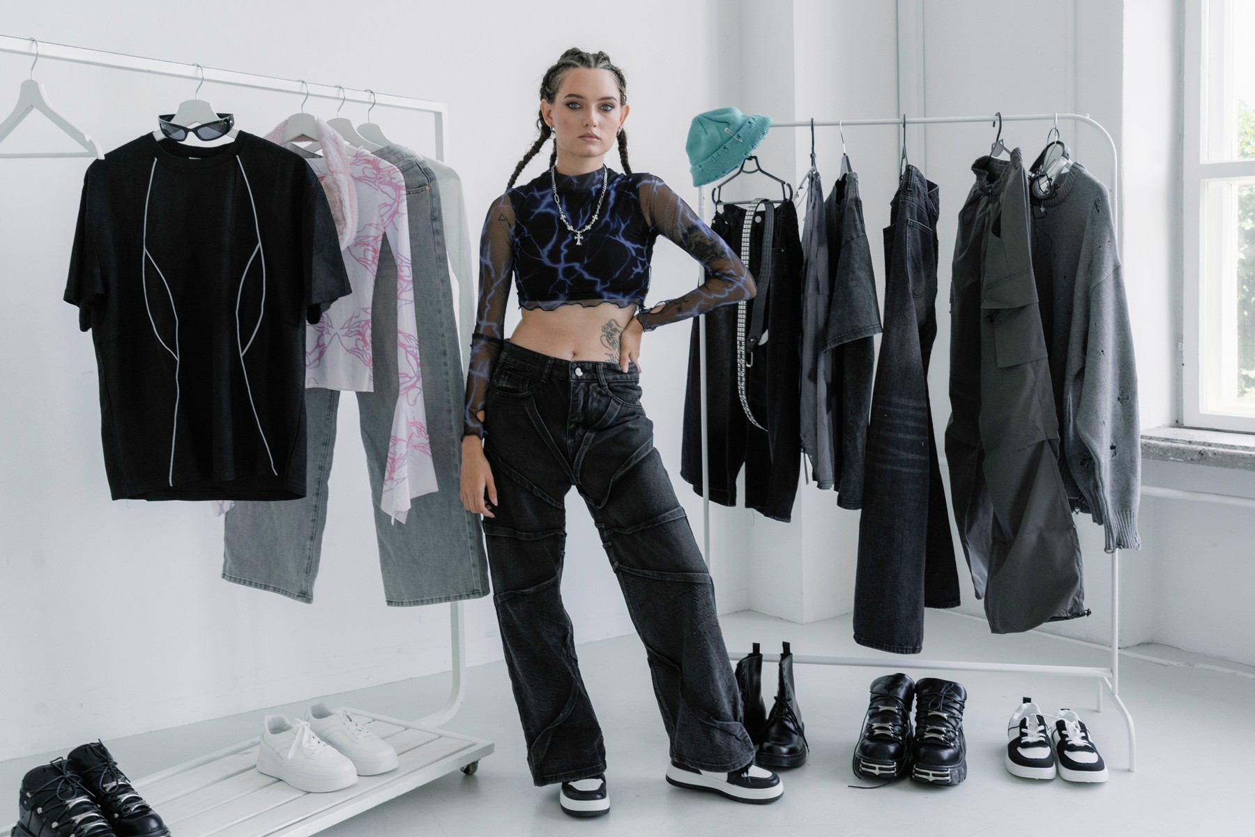 Fashion styling with a complete outfit and a rack of clothing